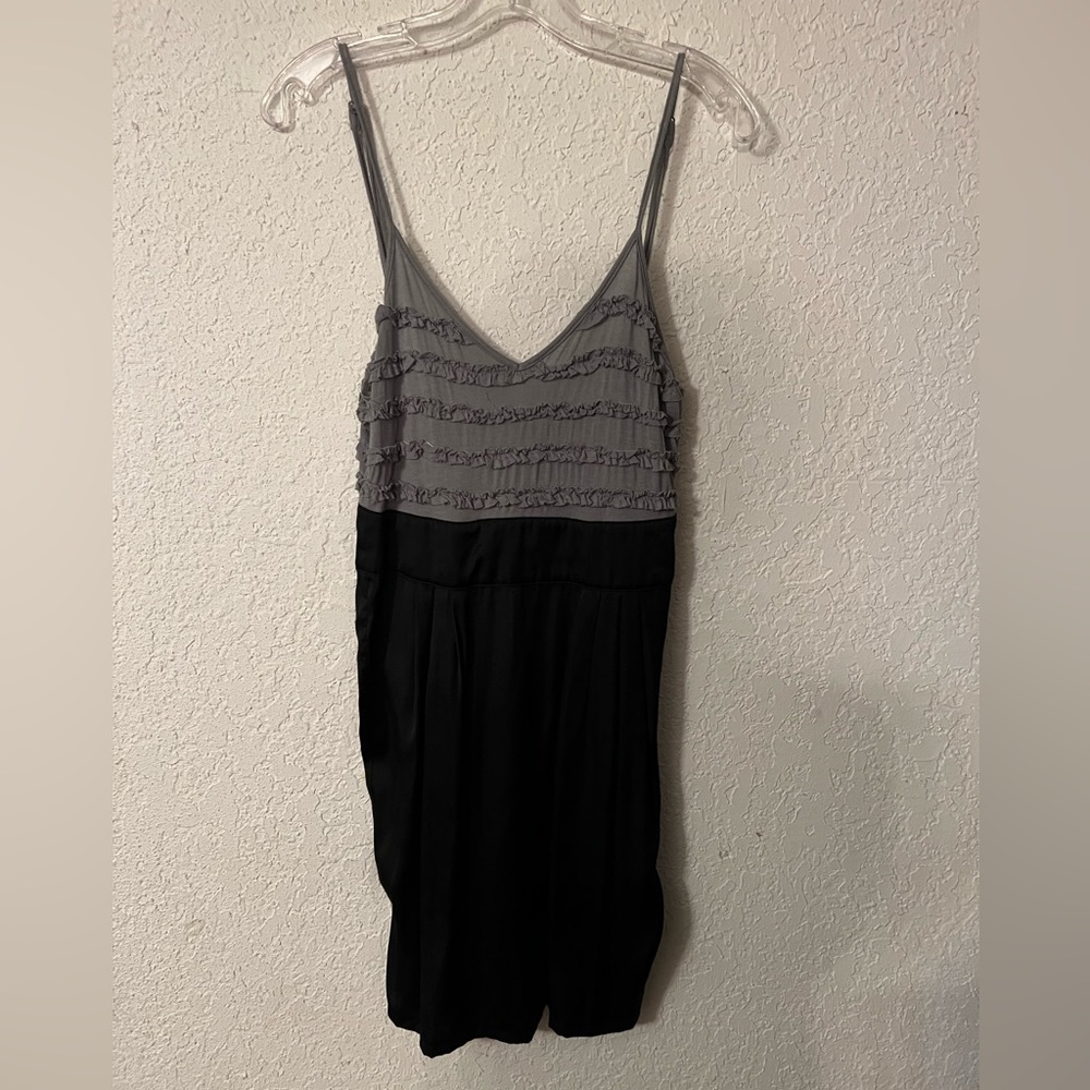 Gray and black, above the knees, ruffled bodice, buttons up the back